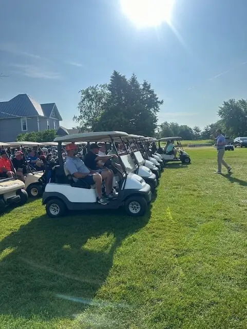 Golf carts lined up for the Annual Chamber Golf Scramble