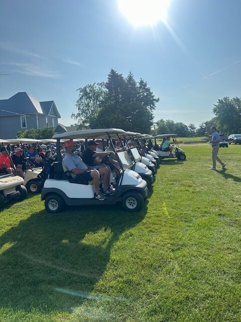 Golf carts lined up for the Annual Chamber Golf Scramble