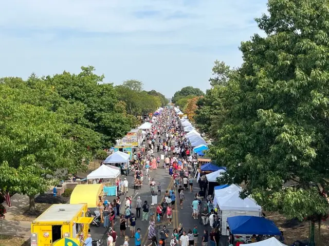 Market Day vendors and visitors filling High Street in Worthington