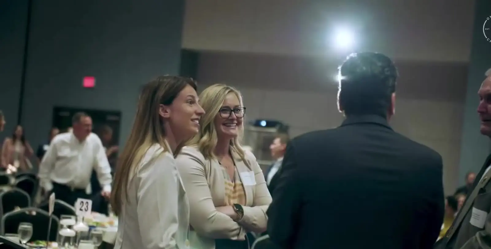 OneZone members talking together at a chamber event