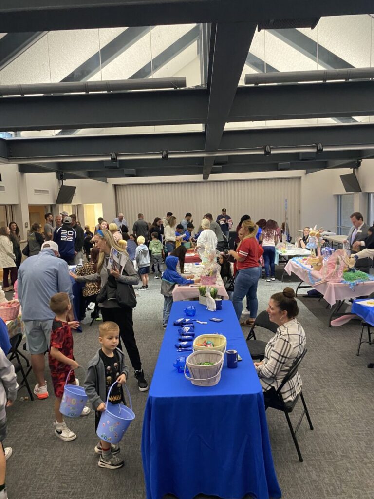 Members and families at chamber event tables