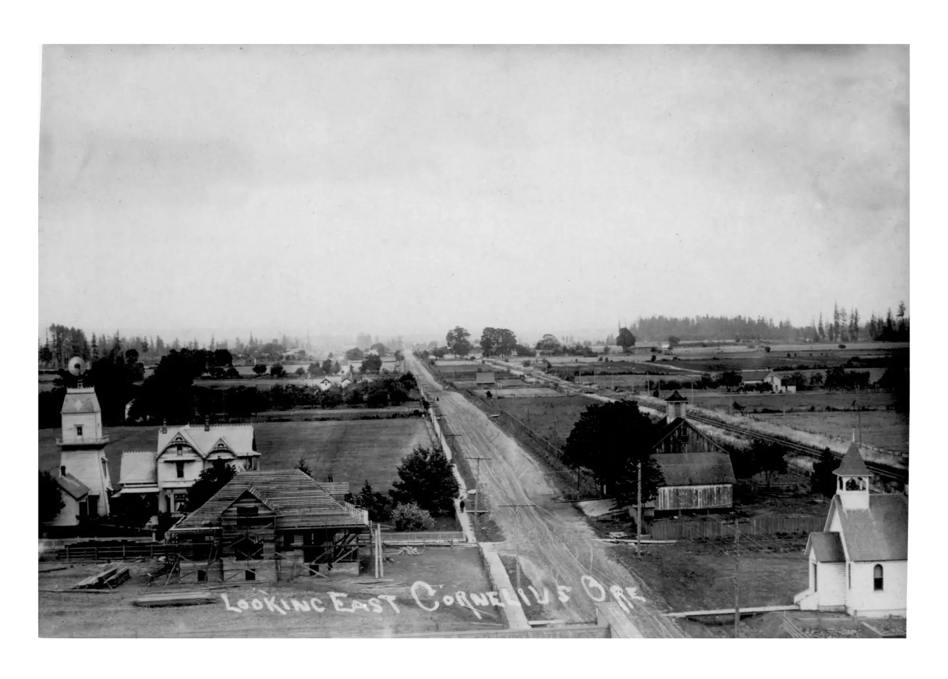 old historic photo of cornelius oregon.  road with houses