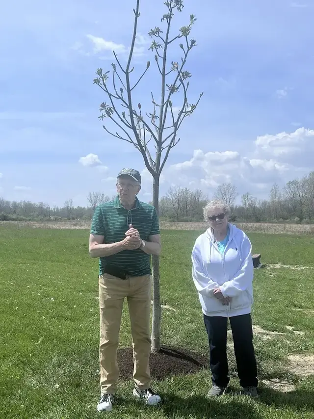 Arbor Day tree planting ceremony in Crestline honoring the memory of Tom Garrett with a Buckeye tree dedication.