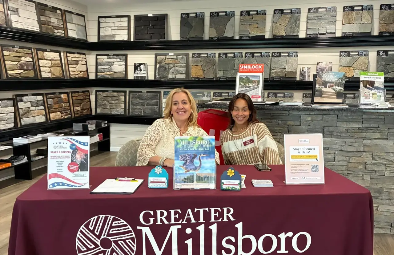 Greater Millsboro Chamber visitor guide table with chamber representatives