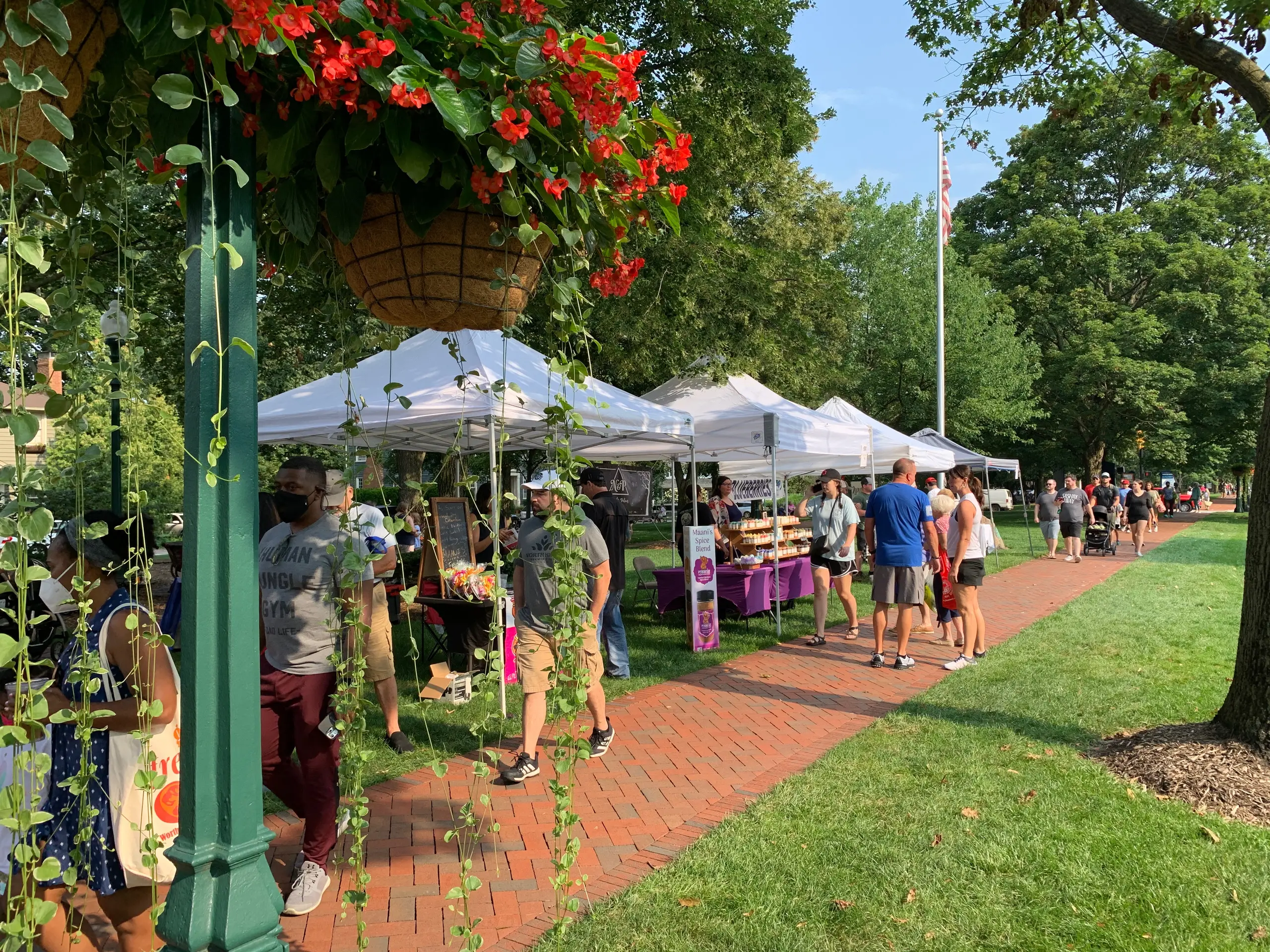 Neighbors visiting vendors at the Worthington Farmers Market