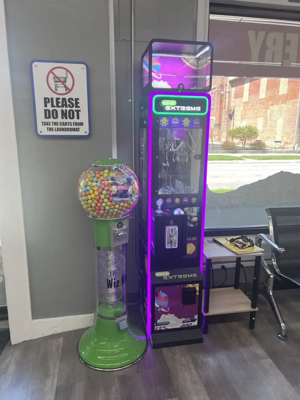 Gumball machine and claw machine inside Uptown Laundry near front door