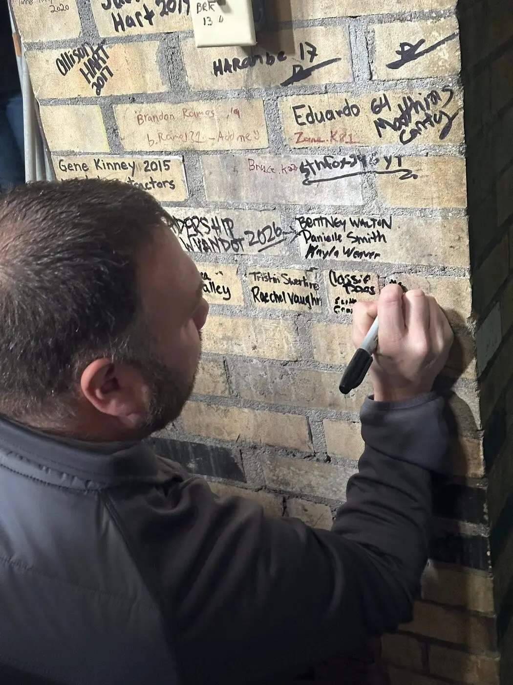 Participant signing the Leadership Wyandot wall