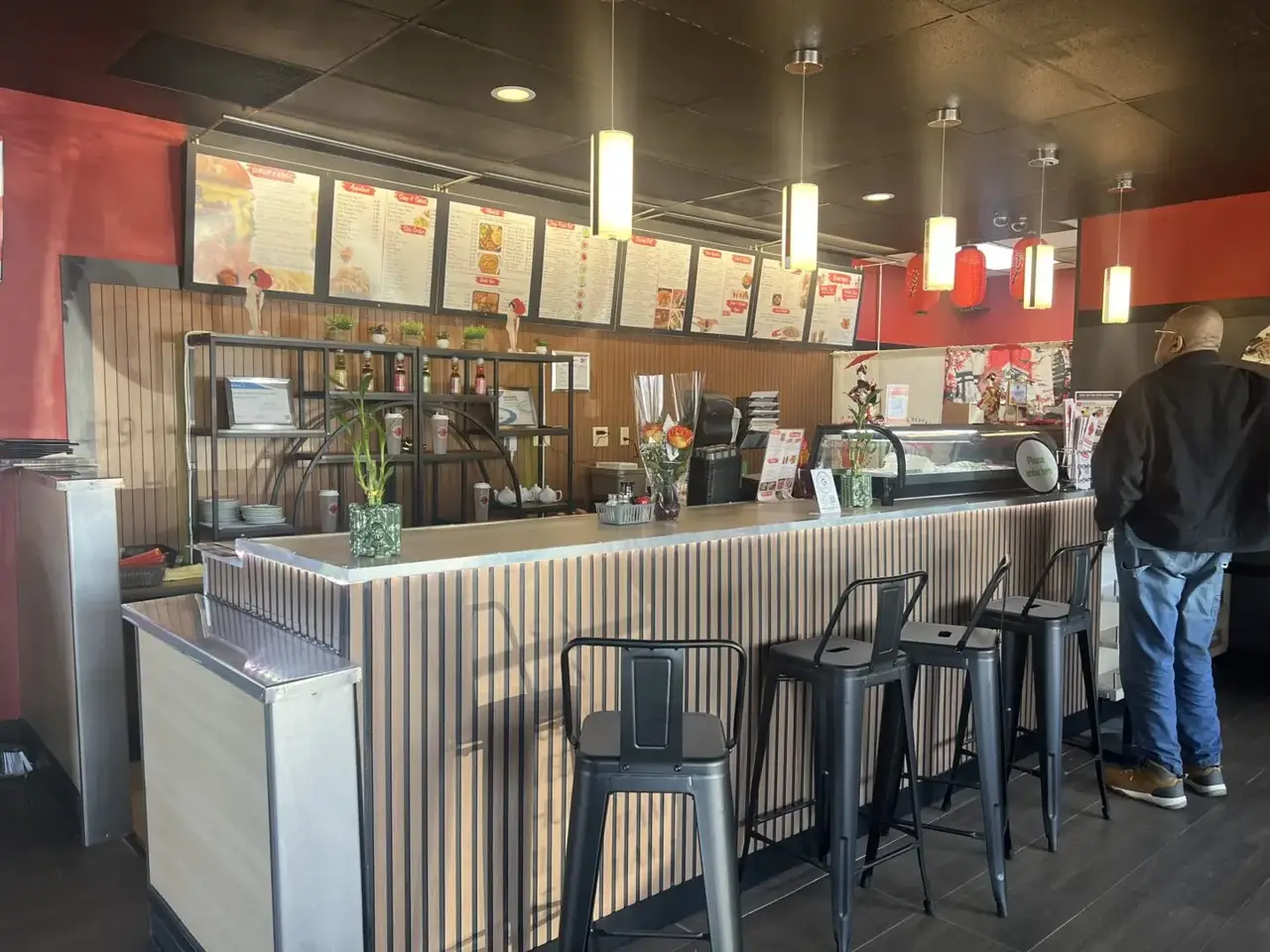Interior dining counter and menu board at Ichigo Japanese Restaurant in Crestline, Ohio.