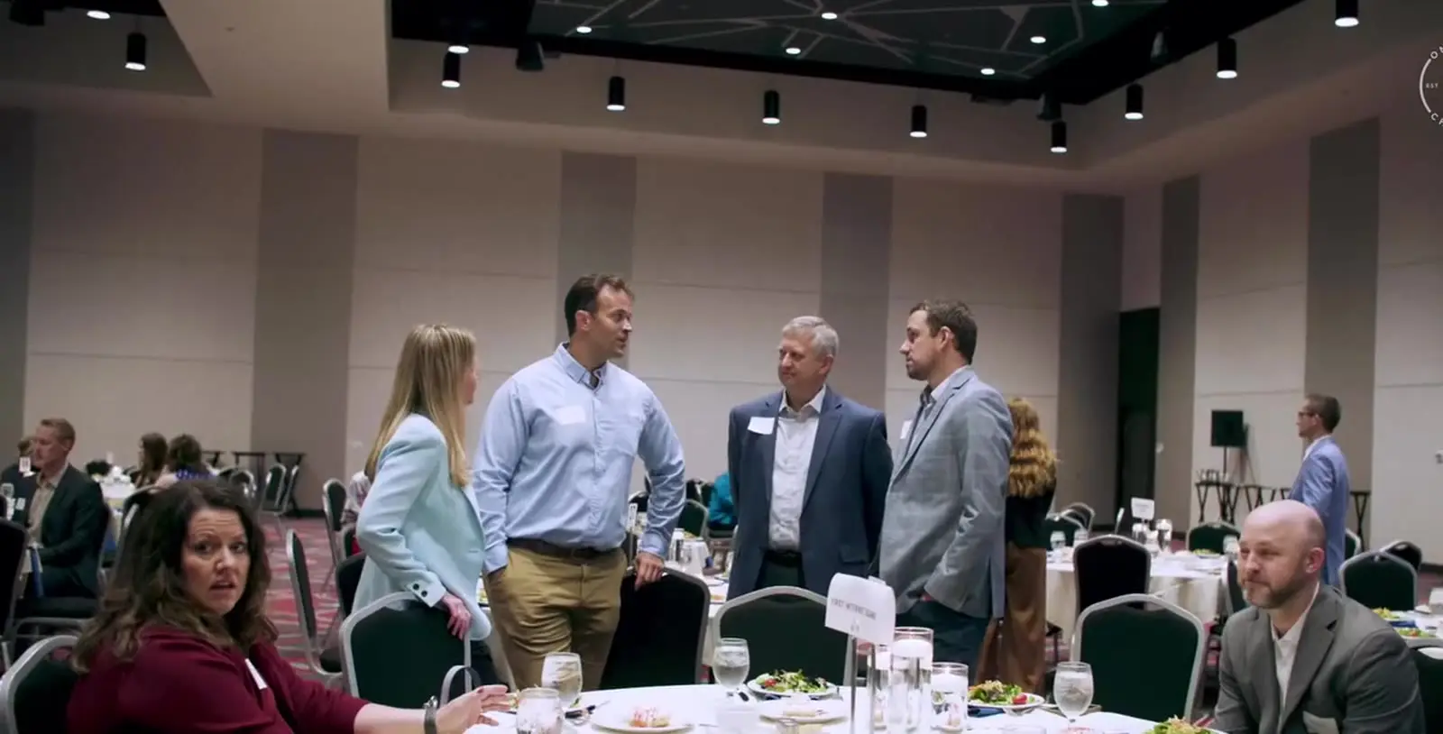 OneZone members talking at a chamber event