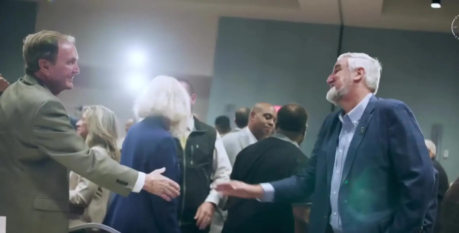 OneZone members greeting one another at a chamber gathering